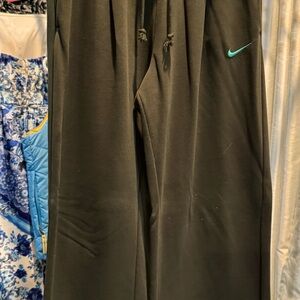Nike wide leg pants with detail waist and split leg.